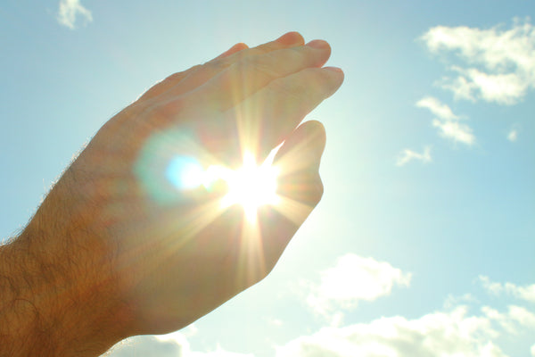 sun shining through hand